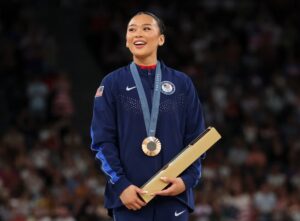 JUST IN: Suni Lee Becomes First American Woman to Win Two Medals in Uneven Bars at Paris Olympics while jokingly said in a speech that her neck is getting sore from weight of all her achieved medals 