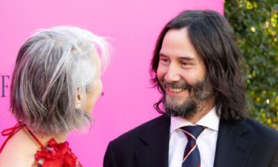 Keanu Reeves Looks Great On The Red Carpet, But Alexandra Grant Outshines Him With Gorgeous Dress In Rare Appearance